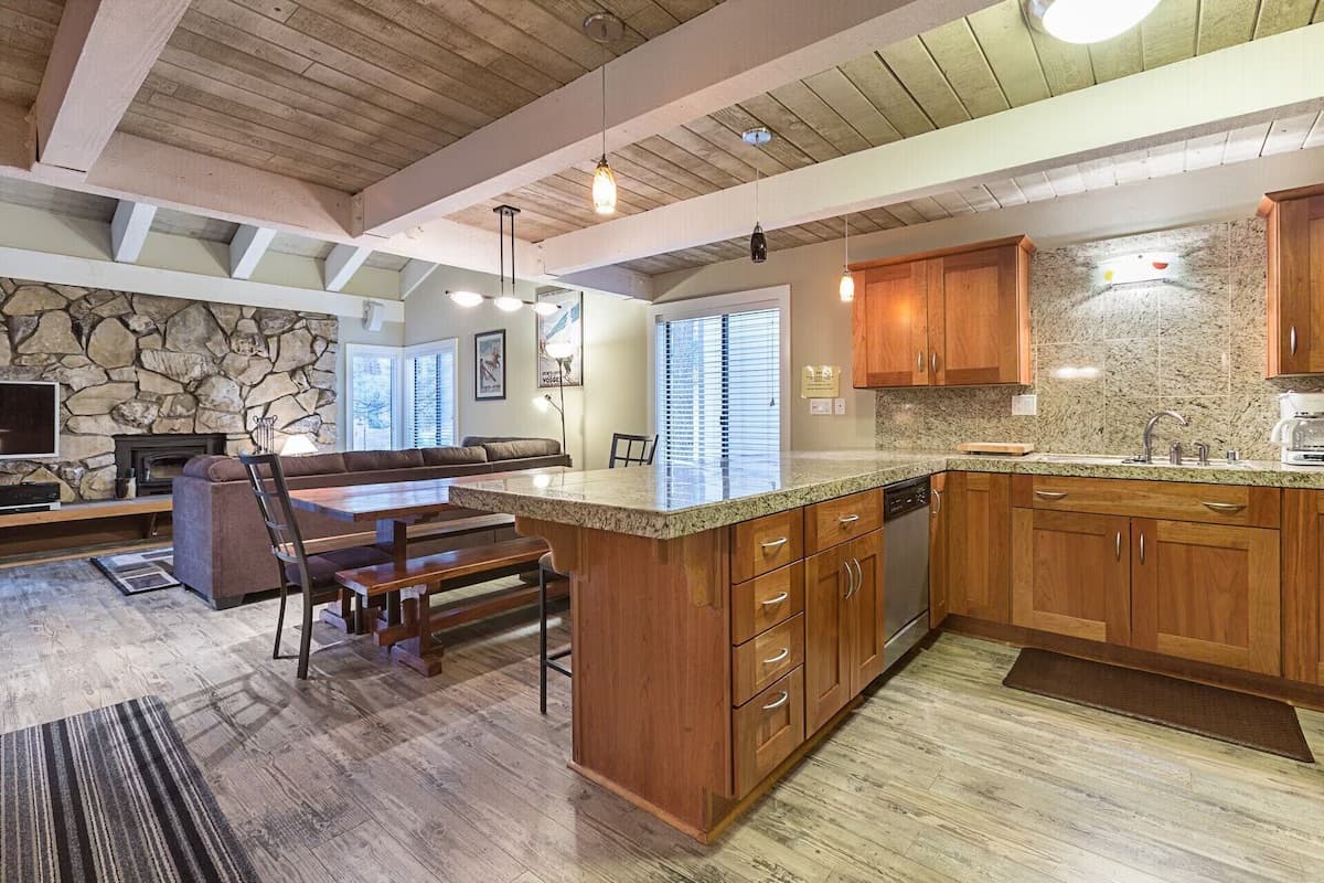 Open kitchen with stone fireplace